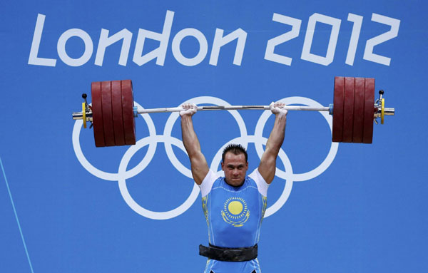 Kazakhstan's Ilya Ilyin lifts on the men's 94Kg group A weightlifting competition at the ExCel venue at the London 2012 Olympic Games August 4, 2012. <STRONG>Weightlifting:</STRONG> Rivals chip away at China dominance