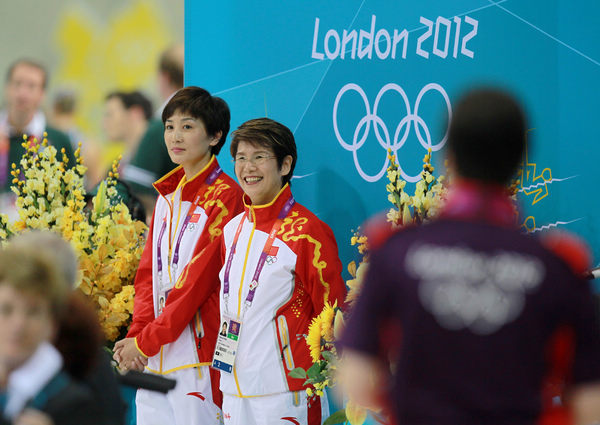 China's synchronized swimming coach Masayo Imura of Japan (right) and assistant Zhang Xiaolei watch the team perform at the London Games. The squad claimed silver in the team event and bronze in the duet. Cui Meng / China Daily Friend? Mother? Coach? Either way, Masayo's a winner