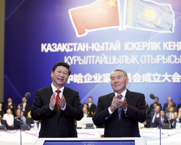 President Xi Jinping (L) and his Kazakh counterpart Nursultan Nazarbayev attend the establishment ceremony of the China-Kazakhstan Entrepreneurs Committee in Astana, Kazakhstan, Sept 7, 2013. Xi urges Chinese, Kazakh entrepreneurs to boost cooperation