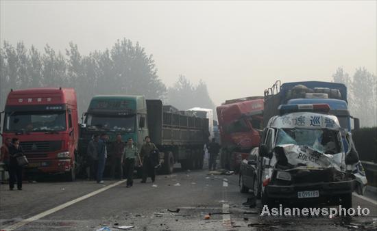 Collided trucks seen on Lianhuo Expressway after a 24-car pileup occurred Friday morning. 10 dead in 24-car pileup in East China