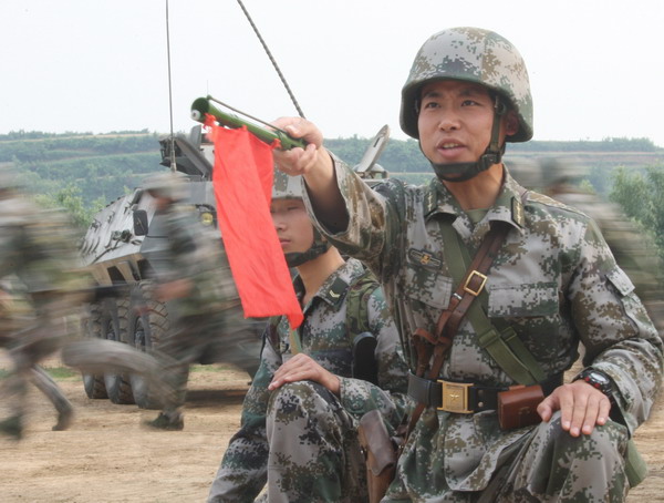 Chu Kewei, a Tsinghua University graduate turned commander, takes part in military training with other soldiers in this file photo. 'Scholar' set to take reins of command