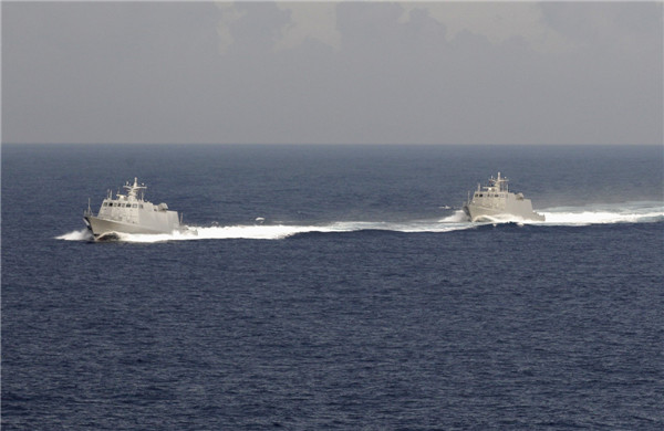 Taiwan military vessels take part in a joint marine drill with coast guard patrol vessels in waters off southern Taiwan, May 15, 2013. Taiwan conducts fishery protection drill