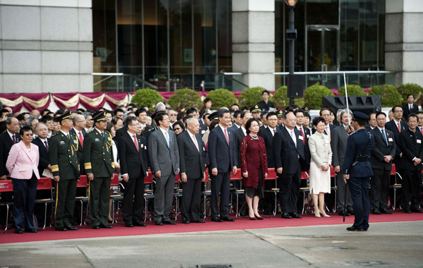 Hong Kong Chief Executive CY Leung (front, 7th L) attends a flag raising ceremony in celebration of the 16th anniversary of the Special Administrative Region's return to China. CY Leung: Govt seeks change, maintains stability