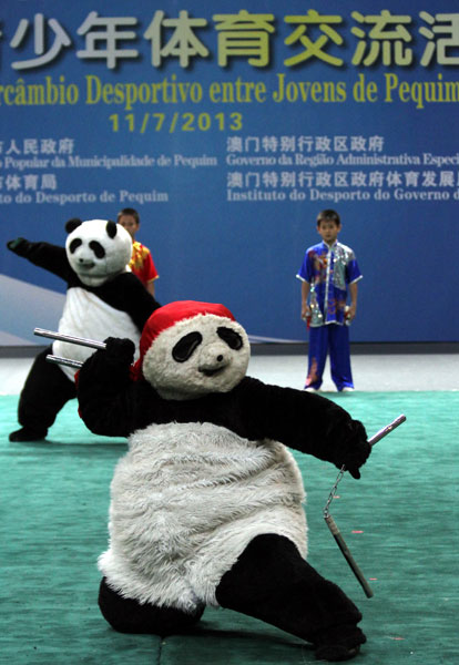 'Kung fu pandas' demonstrate their skills at a sports and martial arts exchange between young people from Beijing and Macao in the special administrative region on Thursday. Parker Zheng / China Daily Exchanges in sports get boost from new agreement