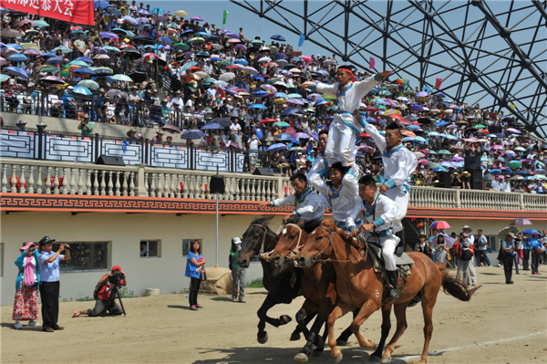 Horse riders gallop into the opening ceremony of the 24th Tourism Naadam Festival Naadam Festival trots into town for wild games
