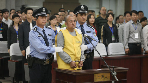 Wang Shujin, a death row prisoner convicted of raping and killing at least four women, stands trial at Handan Intermediate People's Court, in Handan, North China's Hebei province, on Friday. Court upholds serial killer's death sentence