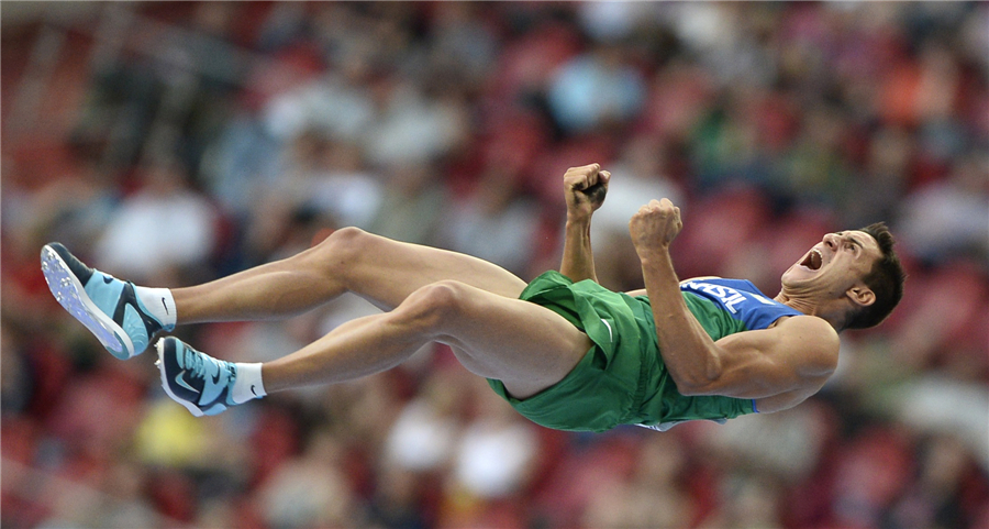Augusto de Oliveira of Brazil celebrates after clearing the bar at the men's pole vault final during the IAAF World Athletics Faces of triumph and defeat at athletics worlds