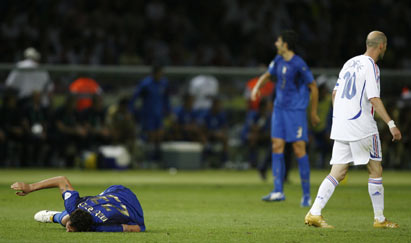 France's Zinedine Zidane (R) walks away after fouling Italy's Marco Materazzi (L) during their World Cup 2006 final soccer match in Berlin July 9, 2006.