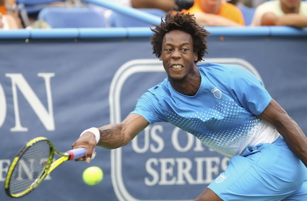 Gael Monfils of France hits a return to Radek Stepanek of Czech Republic during the final match at the Legg Mason Tennis Classic in Washington August 7, 2011. Stepanek upsets Monfils to win Washington title