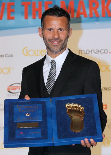 Soccer player Ryan Giggs of Wales with his 'Golden Foot' award during the 'Golden Foot 2011' awards in Monaco, Oct 10, 2011. Ryan Giggs wins 'Golden Foot 2011' award