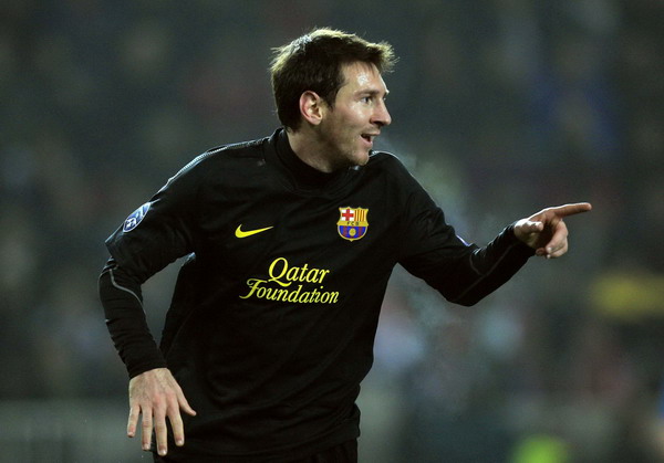 Barcelona's Lionel Messi reacts after scoring against Viktoria Plzen during their Champions League Group H soccer match in Prague Nov 1, 2011. Messi treble puts holders Barca in last 16