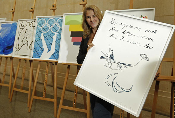 Artist Tracey Emin poses with her Paralympic poster 'Birds 2012' at the unveiling ceremony of the official Olympic and Paralympic posters for London 2012 at the Tate Britain gallery in London November 4, 2011. Official Olympic and Paralympic posters unveiled