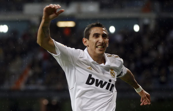Real Madrid's Angel Di Maria celebrates after scoring against Villarreal during their Spanish first division soccer match at Santiago Bernabeu stadium in Madrid Oct 26, 2011. Real's Di Maria has torn thigh muscle, tests show