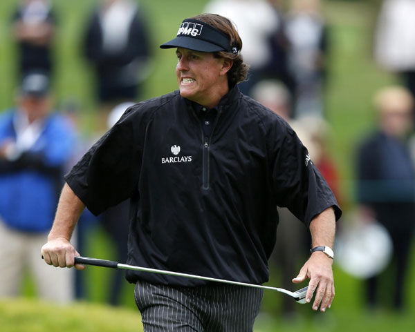 US golfer Phil Mickelson reacts to missing a birdie putt on the 10th hole of the north course at Torrey Pines during first round play at the Farmers Insurance Open in San Diego, California, Jan 24, 2013. Lefty Mickelson commands spotlight at Pebble Beach