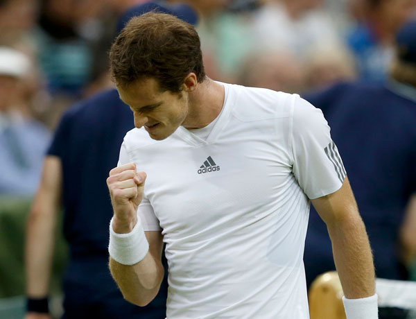 Andy Murray of Britain reacts after breaking Tommy Robredo of Spain in the third set in their men's singles tennis match at the Wimbledon Tennis Championships, in London June 28, 2013. World No 2 Murray cruises to last 16