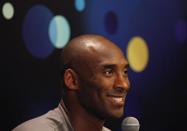 Los Angeles Lakers NBA star Kobe Byrant smiles during a news conference in the southern Chinese city of Shenzhen August 4, 2013. Kobe Byrant meets fans in Shenzhen