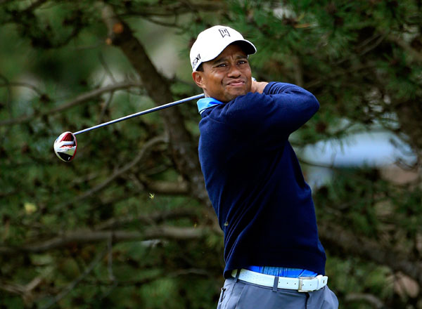 Tiger Woods hits off the fourth tee on Friday. Tiger cops two-stroke penalty